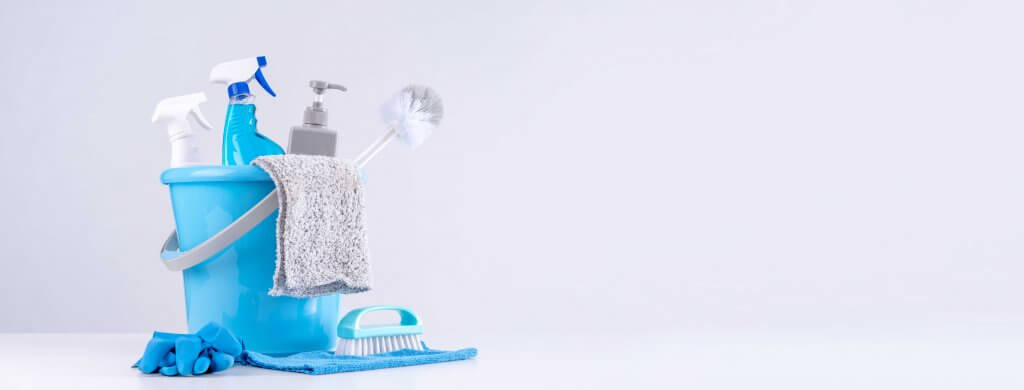 various professional cleaning supplies organized in a bucket