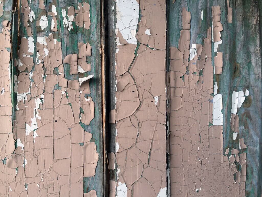 Old paint on a wooden wall.