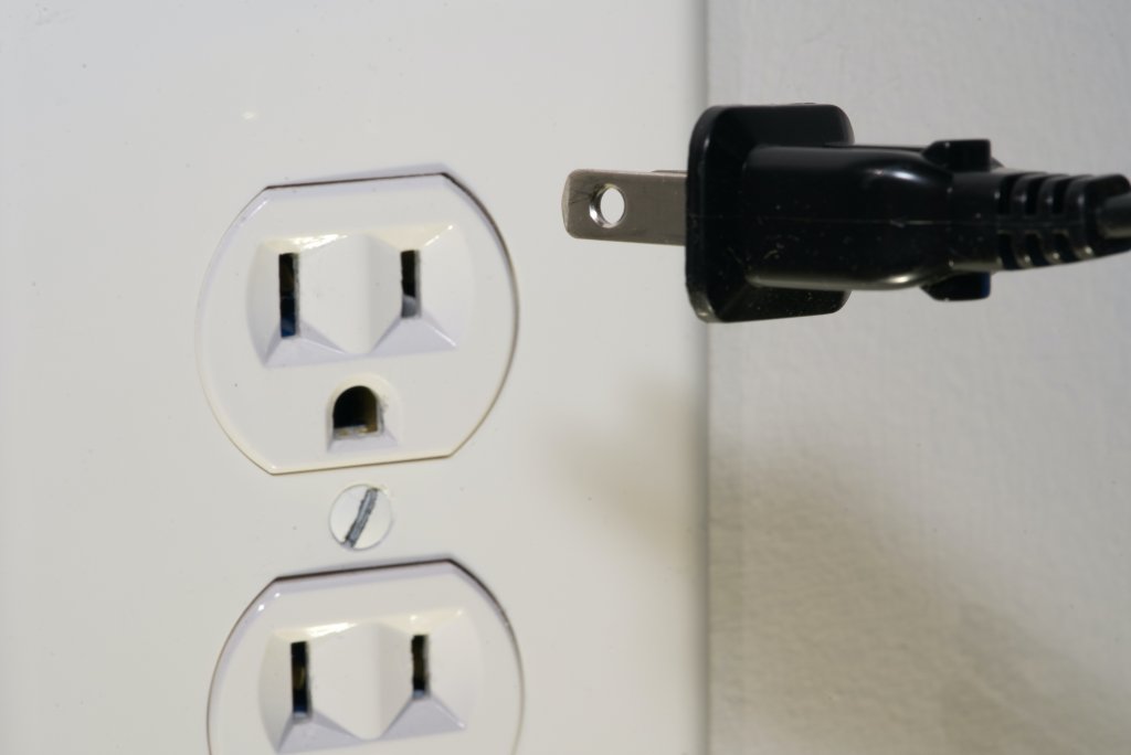 Electrical outlet and plug. Photo by Clint Patterson on Unsplash
