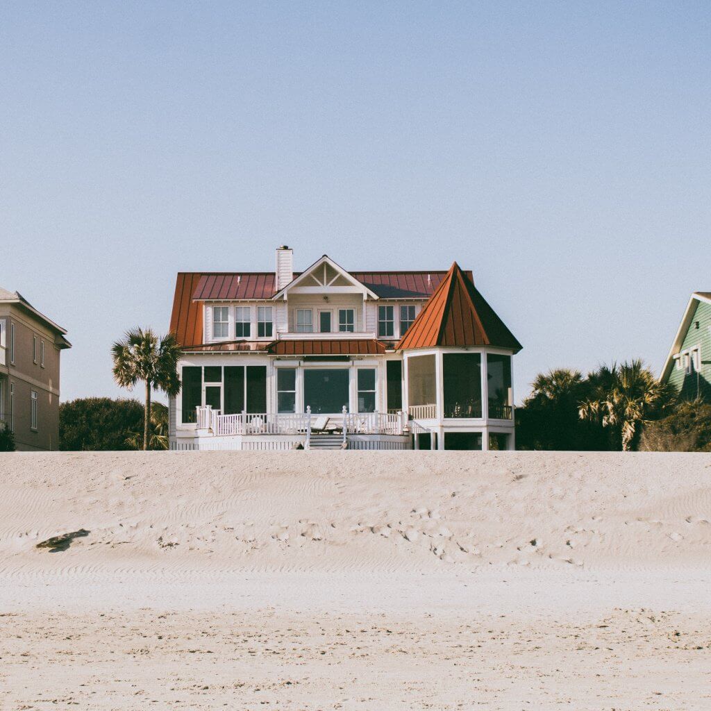 House on the beach. Photo by Tuce on Unsplash.
