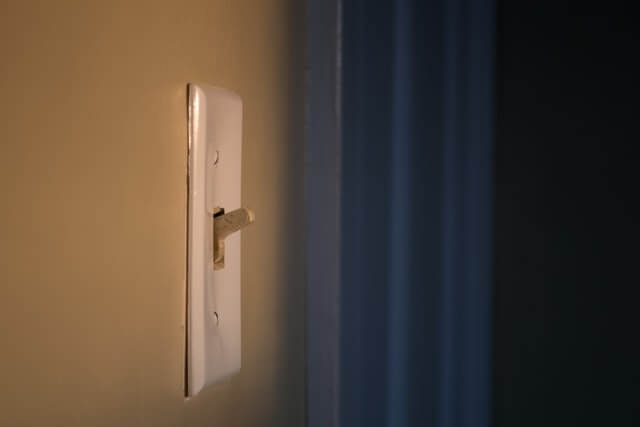 Light switch. Photo by Steve Johnson on Unsplash.