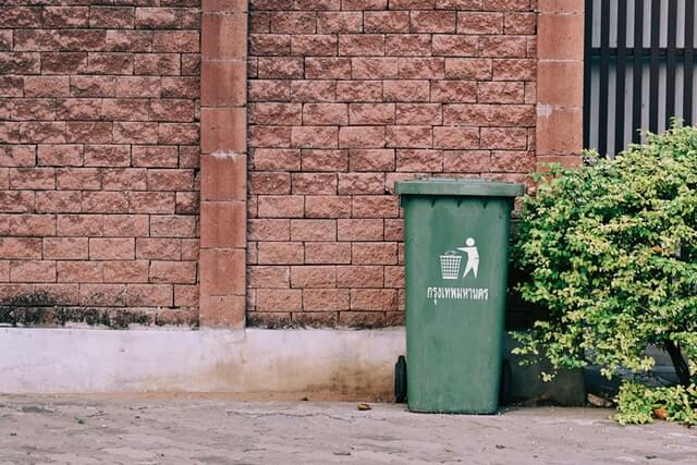 Residential garbage can. Photo by Yoneken on Unsplash.