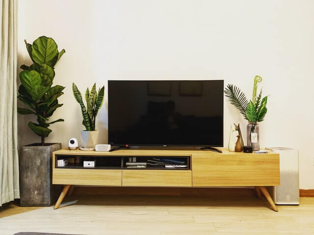 TV and entertainment center. Photo by Wang John on Unsplash.