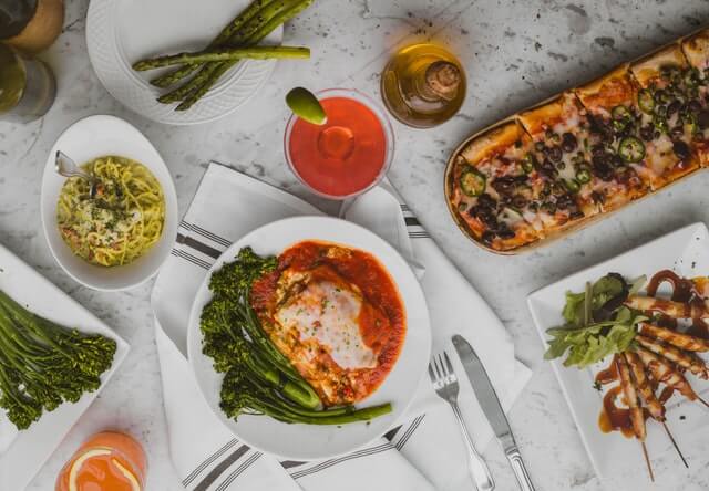 Italian dishes on table. Photo by Pablo Merchan-Montes on Unsplash.