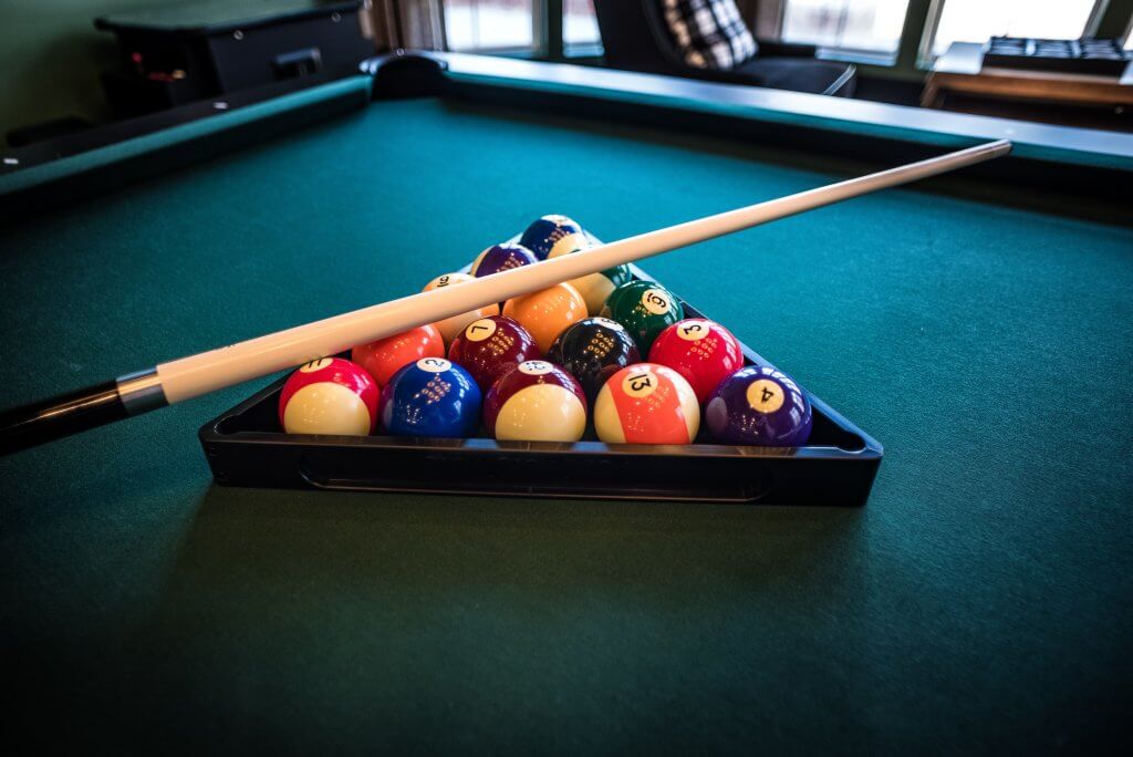 Adding a game room to your vacation rental property can transform a room into a multi-purpose space for your guests.