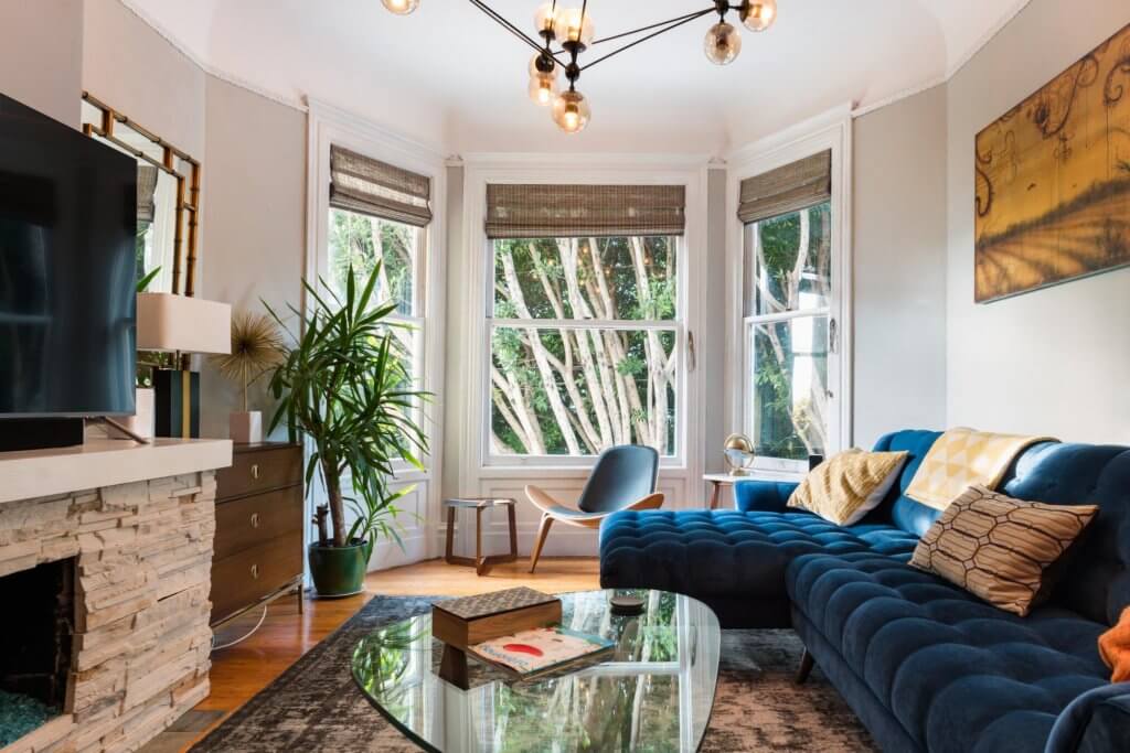 a living room filled with furniture and a fire place.