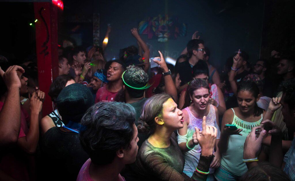 Young adults partying at a rave