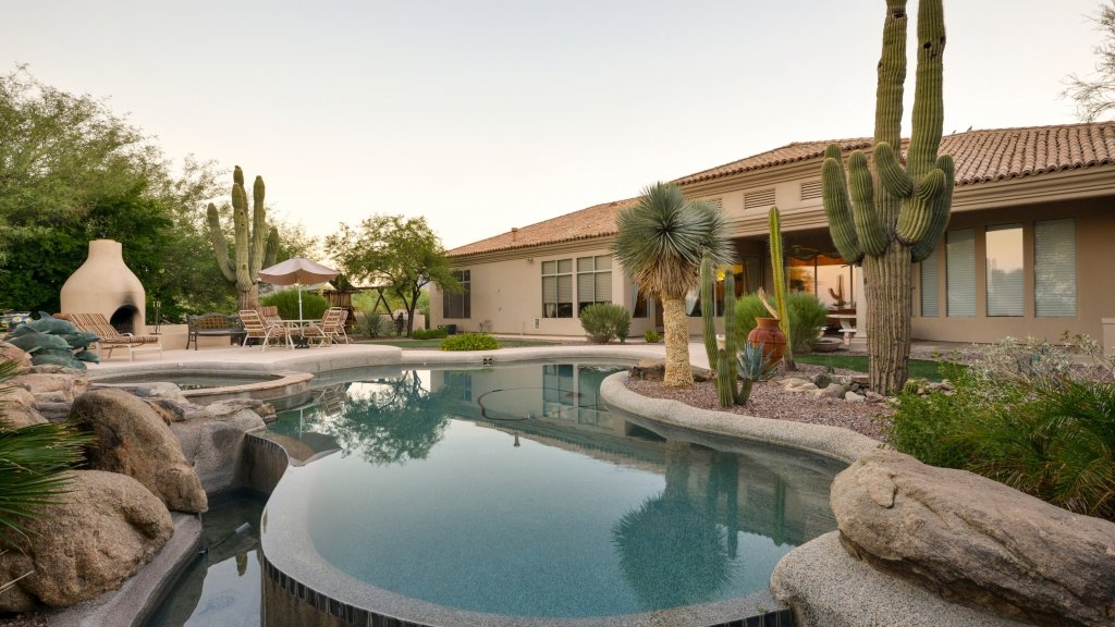 modern pool in the backyard of a desert home